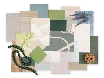 A flat lay of various textured and colored wallcovering samples andswatches, including greens, blues, and neutrals, accented by lavender sprigs and walnuts, creating a natural, earthy tone.