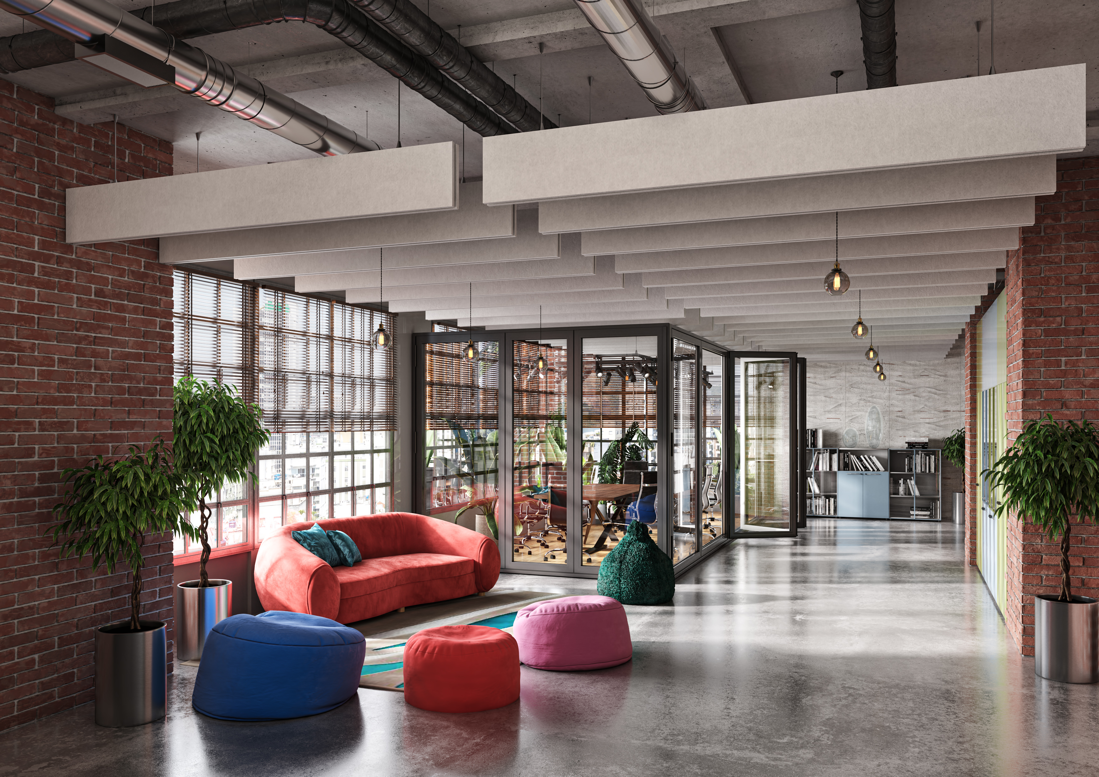 Modern office space with a red couch, colorful bean bags, potted plants, brick walls, large windows, and a glass meeting room. Bright and inviting atmosphere.