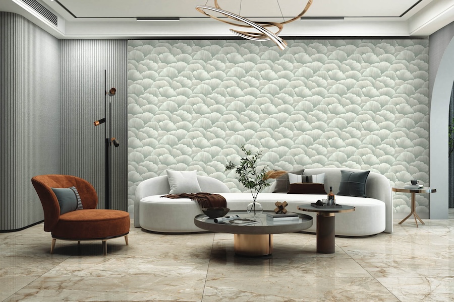 Luxurious living room with a modern design. Features a scalloped textured wall, round white sofa, rust-colored chair, and marble floor, creating an elegant ambiance.