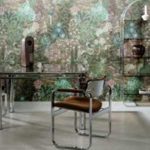 Modern interior with a glass-topped table, brown leather chair, and lush botanical wallpaper. Shelving and decor evoke a calming, stylish atmosphere.