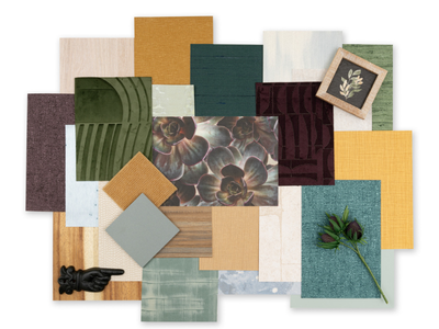 A collage of various textured and colored wallcoverings and wood samples, including green, gold, teal, and floral patterns, arranged next to a small plant and a pointing hand sculpture.