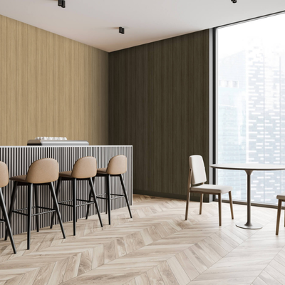 Modern cafe interior with light wood flooring and walls. Features a sleek bar counter with bar stools and a small round table with chairs by a large window. Calm ambiance.